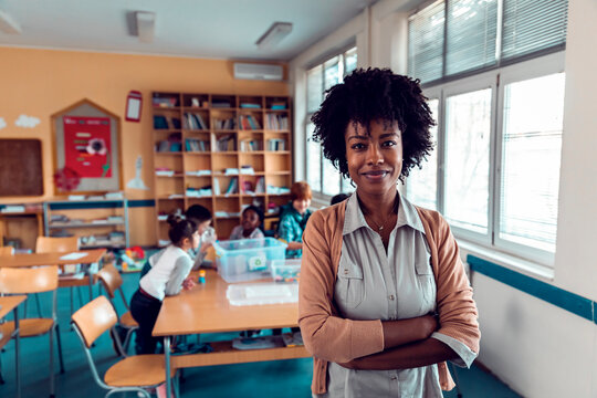 Portrait of a young African American elementary school teacher at her classroom