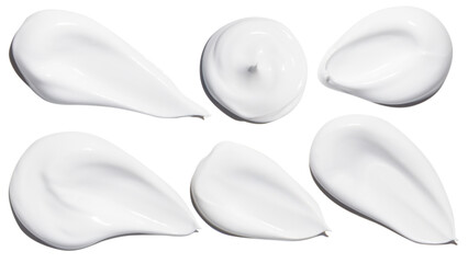 A set of smears of cosmetic cream on a white background