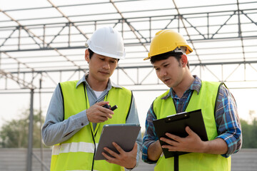 Engineers team use tablet and check the blueprint on site. Contractor and inspector inspection construction during project.civil Forman check quality assurance. Audit, inspect, quality control.