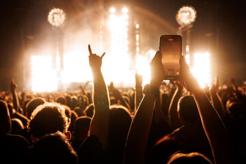 People Taking Photos At A Music Concert With Smartphones.