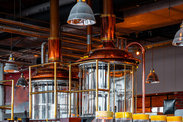 Modern brewery mash tuns. Glass tuns. Copper elements for brewing Boiling and mashing tun. Brewery `close-up backgrounds. - obrazy, fototapety, plakaty