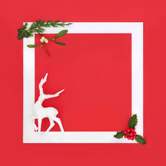 Christmas Eve north pole reindeer, with holly, winter greenery background design. Festive theme for...