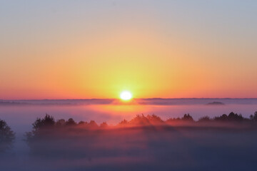 Naklejka na ściany i meble Sunrise over Mist 