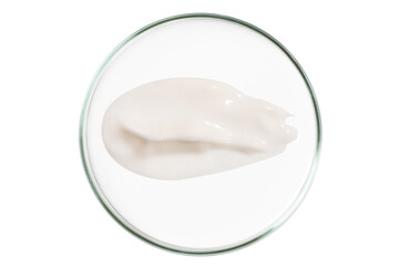 Petri dish isolated on empty background. A smear of cosmetic cream in a Petri dish.