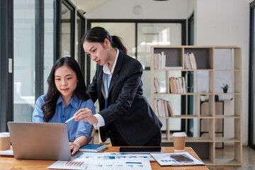 Business and woman in a meeting, laptop and brainstorming with ideas, cooperation and feedback. Face, Asian person or corporate professional with teamwork, planning for a project or support