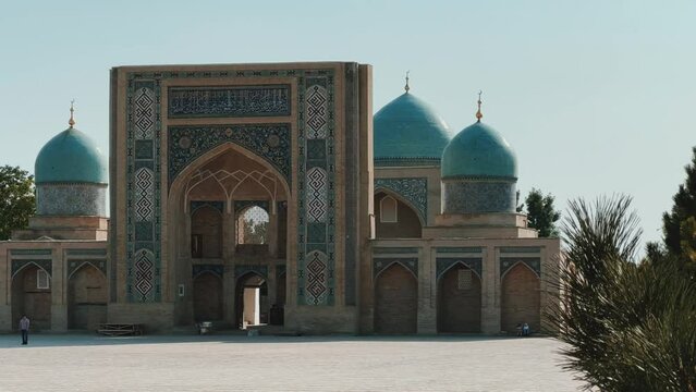 Khast Imam Square with an architectural complex combining ancient religious buildings with modern ones. Lawns, flower beds, shrubs. Cathedral Mosque in Tashkent. 4K