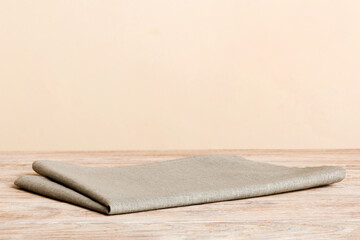top view with gray kitchen napkin isolated on table background. Folded cloth for mockup with copy space, Flat lay. Minimal style
