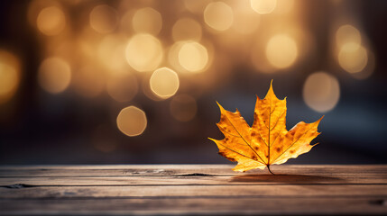 Naklejka na ściany i meble Golden Maple Leaf Over Rustic Wooden Table with Soft Bokeh Lights in the Background
