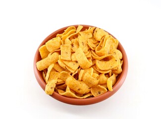 Corn chips, barbecue flavored, in an earthenware  bowl on white background.