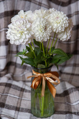 bouquet of white chrysanthemums in a vase on the table