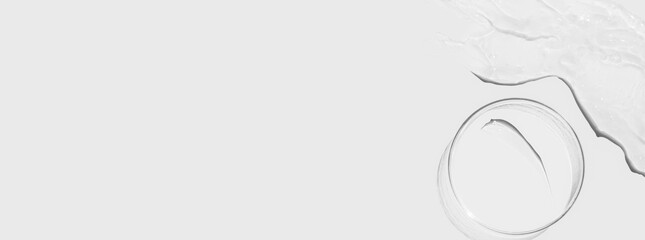 Petri dishes on a light background, transparent gel smears. Empty advertising space