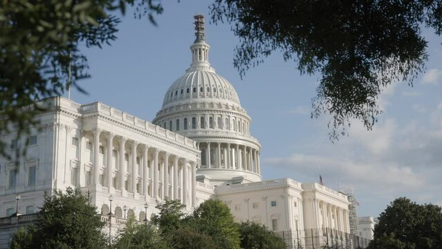 Establishing Exterior Shot During The Day Time And View Of White Capital Building On United States Of American Mall With Congress Senators And House Of Representatives Chambers Inside