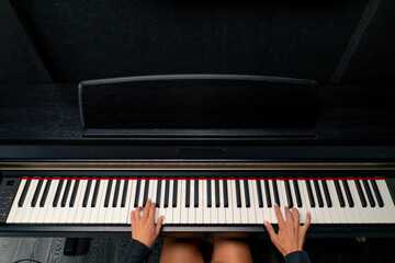 The shot above is of a young girl sitting at the piano and playing beautiful lyrical melody