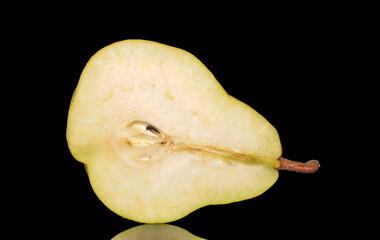 One half of a ripe pear, macro, isolated on black