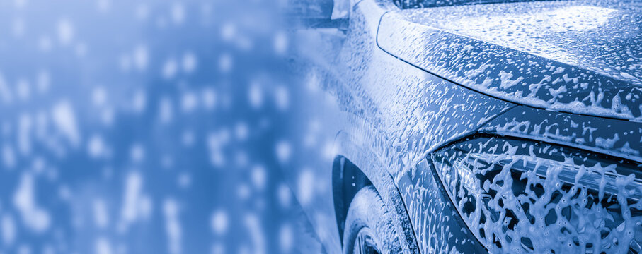 car cleaning and washing with foam soap background