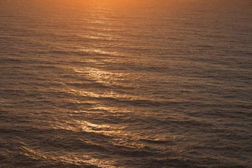 Fotobehang Bright beautiful orange sunset in the ocean © liusan 