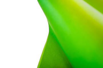 Curvy green paper and white negative space forming abstract pattern