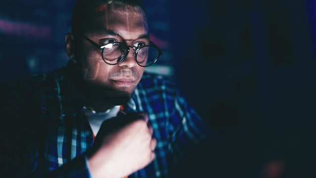 Closeup of African American man writing computer code, IT developer at work