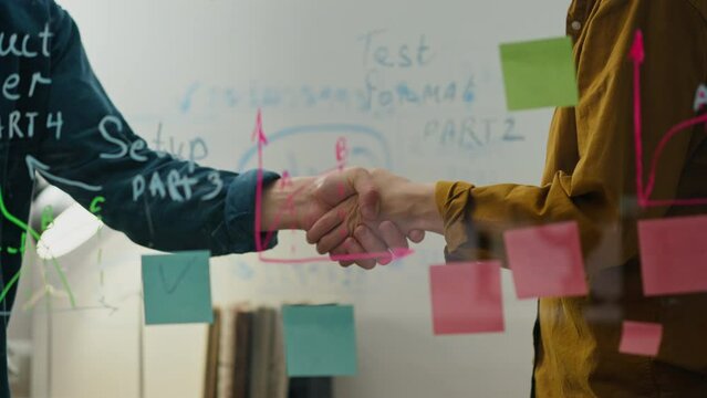 Cooperation, Woman businessman Leisurely shaking hands in the investment and finance room handshake, In slow motion Young woman Holding a meeting of revolutionary technologies