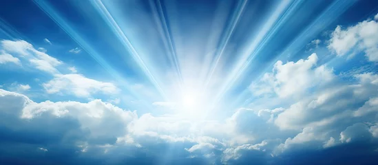 Foto op Plexiglas Sunlight bursting through clouds against a blue sky with a spiritual and religious context © AkuAku