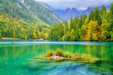 Laghi di Fusine inferior lake, Tarvisio, Italy. Amazing autumn landscape, crystal clear water with...