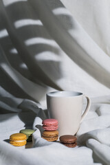 Macaroons, mug, isolated on white background with shadows