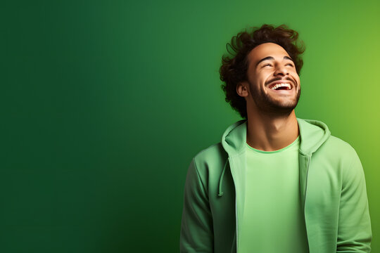 Ultra handsome man, smiling and laughing, wearing bright clothes. Bright solid green background. created by generative technology.