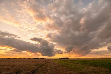 Rolgordijnen Colorful sunrise over the plains © Menyhert