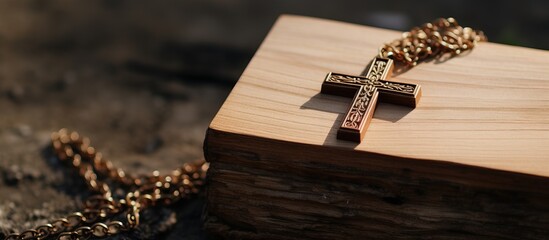 Detailed image of plain wooden religious cross pendant on sacred Bible - obrazy, fototapety, plakaty