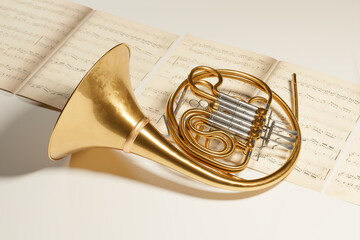 French horn on the music note sheets. Elegant brass instrument. Orchestra. Gold