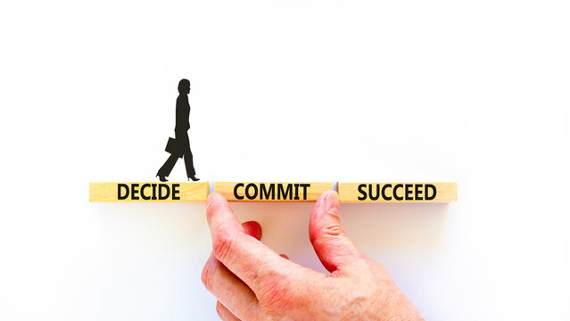 Decide commit succeed symbol. Concept word Decide Commit Succeed on beautiful wooden block. Businesswoman icon. Beautiful white table background. Business decide commit succeed concept. Copy space.