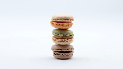 Close-up of some macarons, typical French desserts, white background