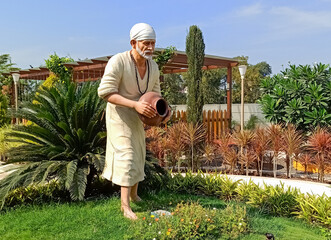 Shirdi Sai baba statue with green background