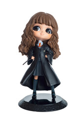 Fototapeta premium Figures of children wizards from books and films about Harry Potter isolated on a white background close-up, Hermione Granger