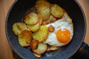Fried potatoes with scrambled eggs