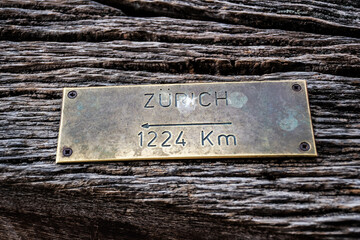 Sign indicating the distance to Zurich (Switzerland) 1224 km in the Clock tower in Sighisoara, Romania.