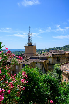 Travel destination, small ancient village Cotignac in Var, Provence, surrounded by vineyards and cliffs with troglodytes houses.