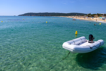 Crystal clear blue water of legendary Pampelonne beach near Saint-Tropez, summer vacation on white sandy beach of French Riviera, France