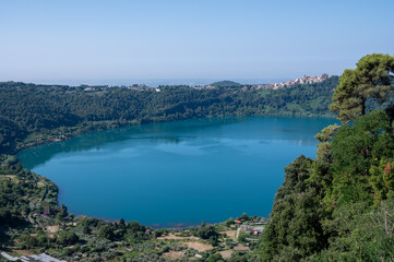 Small historical town Nemi, view on green Alban hills overlooking volcanic crater lake Nemi, Castelli Romani, Italy in summer