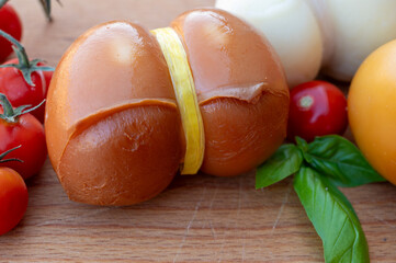 Italian semi hard handmade smoked scamorza cheese, from cow milk from Apulia or Calabria regions...