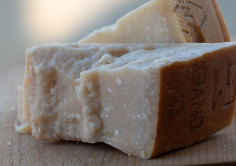 Traditional italian food - 36 months aged in caves Italian parmesan hard cheese from Parmigiano-Reggiano, Italy