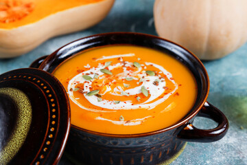 Traditional autumn butternut squash soup with seeds.