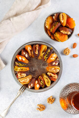 Handmade snacks from dried apricots filled with various nuts.