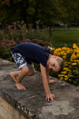 Happy boy indulges in the park. Raising children without punishment