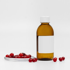 Cosmetic brown glass bottle and cranberry on white background. Background for cosmetic product branding, corporate identity and packaging inspiration. Mockup