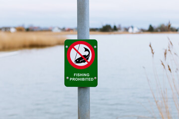 Fishing prohibited sign near lake - NO FISHING