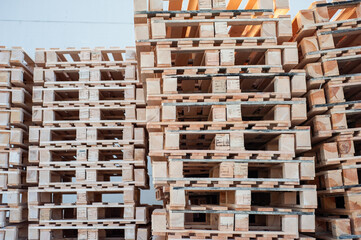 stacked pallets in warehouse. Wood industry