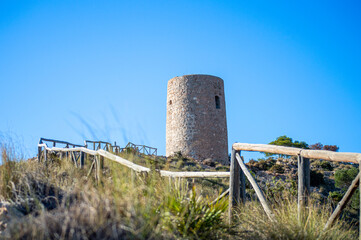 Mediterranean coastal landscape. Historic Torre Vigia De Cerro Gordo, a watchtower looking out for any marauding pirates. La Herradura, Andulasia, Southern Spain