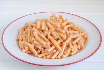 Creamy Tomato Pasta in ceramic plate.