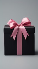 Gift box with red ribbon bow on black background. black friday shopping sale.